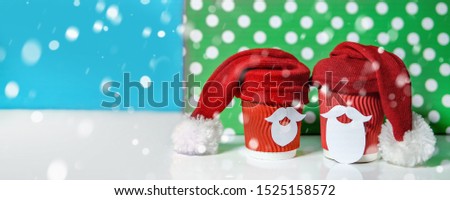 Christmas coffee and shopping concept over green and blue background