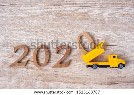 2020 Happy New year with miniature truck or construction vehicle. New Start, Vision, Resolution, goal, industrial, Warehouse concept