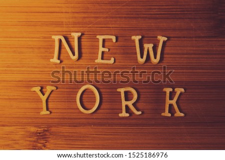 New York pasta letters on the wooden background