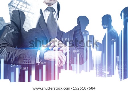 Unrecognizable businessman with smartwatch and his colleagues working together over city background with double exposure of graphs and HUD interface. Concept of hi tech and trading. Toned image