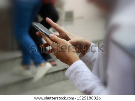 Hands while using the phone Soft blur background