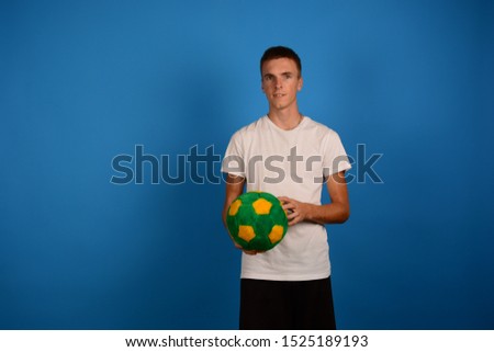 man plays football on a blue background sports