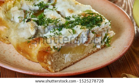Russian pies old traditional Siberian pie with fish and potatoes