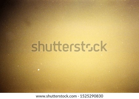 Designed film texture background with heavy grain, dust and light leak