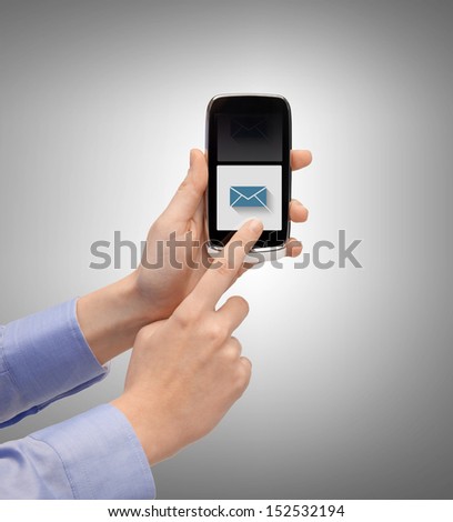 business, technology, internet and networking concept - man hand with smartphone and message icon