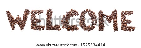 welcome symbol made from coffee beans. 