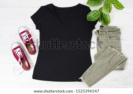 Black casual T shirt mock up top view - casual clothes background, red sneakers
