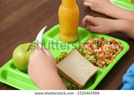 Child with healthy food for school lunch at desk, closeup