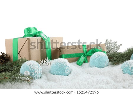 Fir branches, Christmas decoration and snow against white background