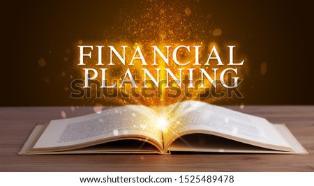 FINANCIAL PLANNING inscription coming out from an open book, educational concept