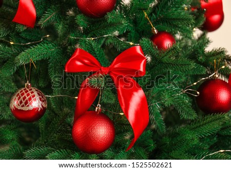 Beautiful Christmas tree with red decorations, closeup