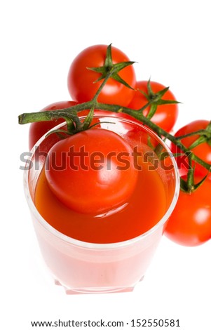 bunch of tomatoes and glass of tomato juice