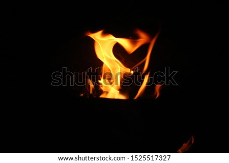 A small fire, a strange appearance that burns at night on a black background