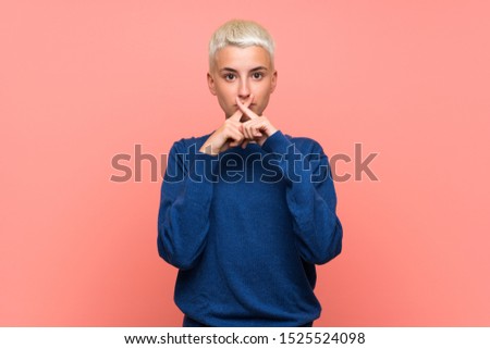 Teenager girl with white short hair over pink wall showing a sign of silence gesture