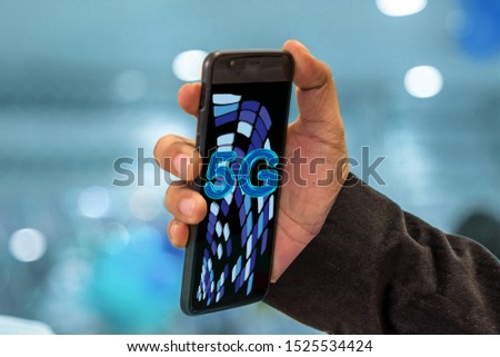 hand holding 5G network mobile smart phone.