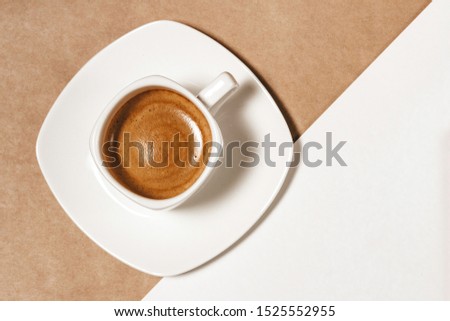 coffee with a beautiful pattern on a white-beige background, top view, stylish morning or desktop, coffee break