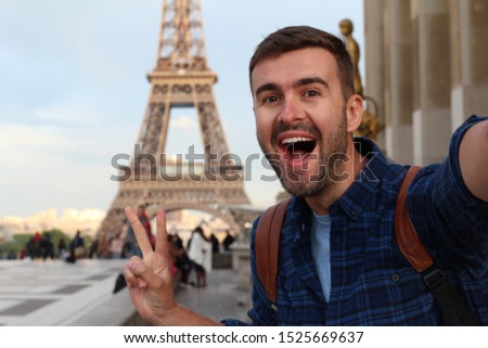 Cute tourist taking a selfie in France