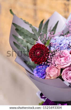 Colorful flowers assorted bouquet in color paper. Holiday celebration concept background copy text.