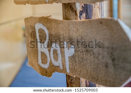 Wooden sign with the German inscription bar