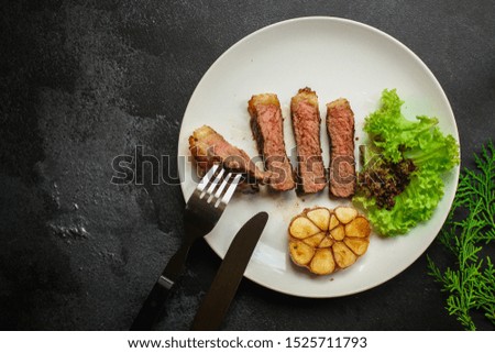 beef steak fried grill (delicious meat, sliced ​​portion serving, roast rare) menu concept. food background. copy space. Top view