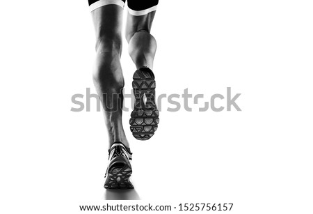 Sports background. Runner feet running closeup on shoe. Isolated on white. Royalty-Free Stock Photo #1525756157