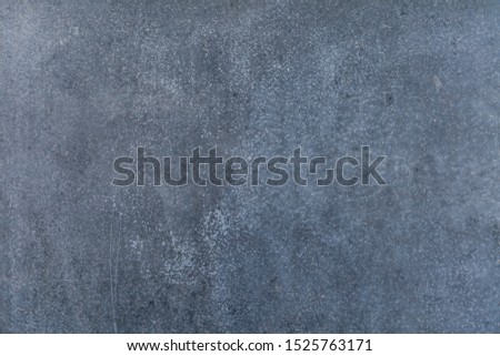 Dark gray concrete texture with scratches.