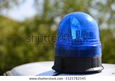 Blue light flasher on a top of a police car