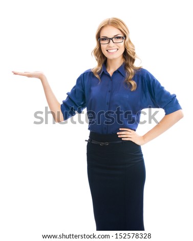 Happy smiling beautiful young business woman showing copyspace or something, isolated over white background