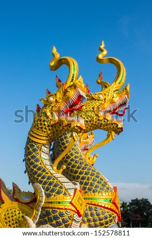 Thai dragon or king of Naga statue under blue sky