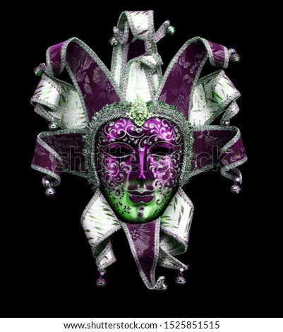 Purple green venice carnival mask isolated on black 
