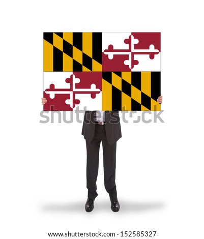 Smiling businessman holding a big card, flag of Maryland, isolated on white