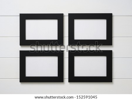 black frames on white wall