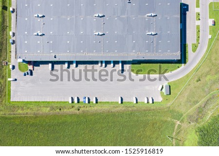 aerial top view of warehouse storage with trucks for loading goods