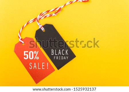 Internet online shopping, Promotion Black Friday text on black tag and 50% sale text on red tag with yellow background
