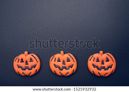 Dark background with halloween pumpkins. Copy space for your text.