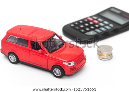 red car and calculator on white background . insurance concept