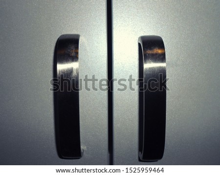 Gray doors with aluminum handles.