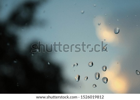 Drops on the windowpane. Autumn day, rain, bad weather. The concept of a bad day, sadness, melancholy, despondency. it was the background for the label.