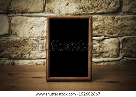 old photo frame on the wooden table