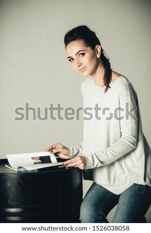 stylish girl reads a magazine