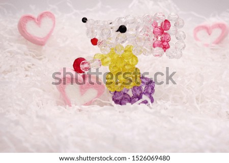 Toy mouse made of beads and marshmallows pink hearts on white background. Happy New year 2020. Greeting card. New year and Christmas concept.