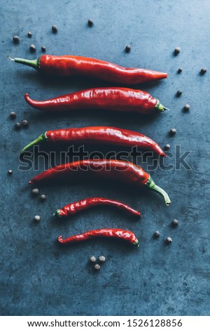 Red chili peppers on cement