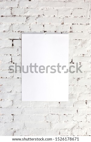 Mock up blank empty picture or sheet on the white brick wall background. Copyspace, negative space for your advertising.