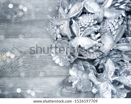 winter christmas background with fir silver cones wooden texture                              