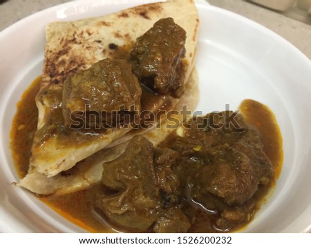 Home made Indian Chapati with spicy mutton curry served during Diwali Festival