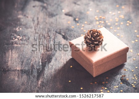 gift box on wooden table with copy space, christmas background.