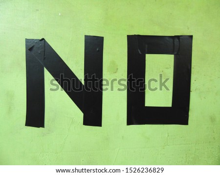 the words "NO" are black on the wall, don't or prohibition signs.      