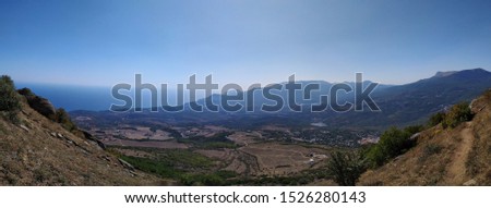 A panoramic picture with a view of the Crimean mountains in the "Ghost valley" is a legendary place visited by tourists, near the city of Alushta, Crimea, Russia.