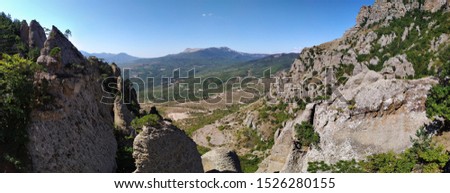 A panoramic picture with a view of the Crimean mountains in the "Ghost valley" is a legendary place visited by tourists, near the city of Alushta, Crimea, Russia.