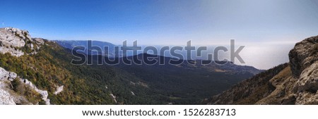 A panoramic picture with a view of the Crimean mountains from the top of the Ai-Petri plateau is a legendary place visited by tourists, near the city of Yalta, Crimea, Russia.